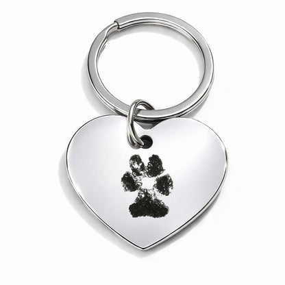 Sleutelhanger met gegraveerde pootafdruk van huisdier in hartvorm, gemaakt van glanzend stainless steel